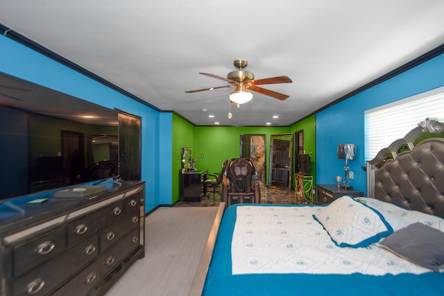 bedroom featuring ornamental molding and ceiling fan