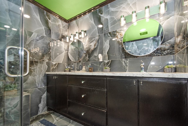 bathroom featuring tile flooring, tile walls, and vanity with extensive cabinet space