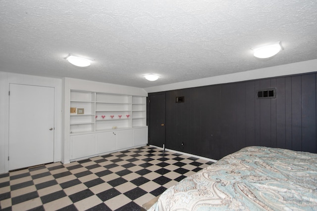 bedroom featuring a textured ceiling