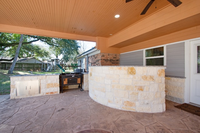 view of patio / terrace featuring area for grilling and ceiling fan