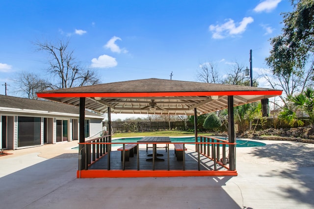 view of property's community featuring a swimming pool side deck and a patio