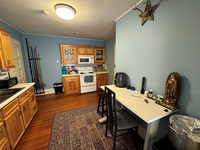 home office with dark hardwood / wood-style floors