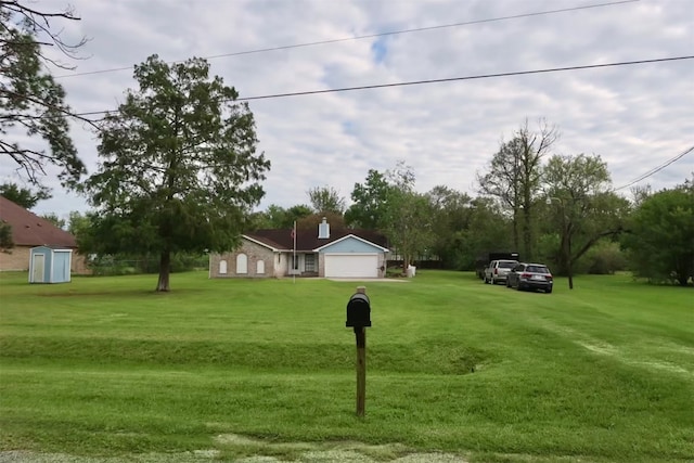 view of yard featuring a garage