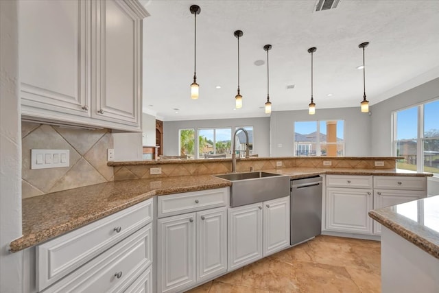 kitchen featuring white cabinets, sink, and stainless steel dishwasher