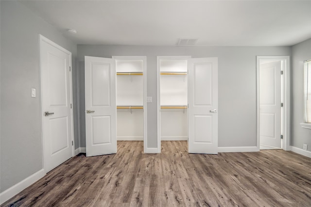 unfurnished bedroom featuring wood-type flooring