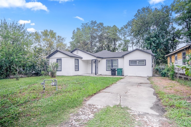 ranch-style home with a front yard