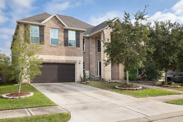 view of front of house with a front lawn and a garage