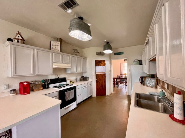 kitchen with white range with gas stovetop, white cabinets, and sink