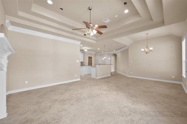 unfurnished living room featuring crown molding, ceiling fan with notable chandelier, and a raised ceiling