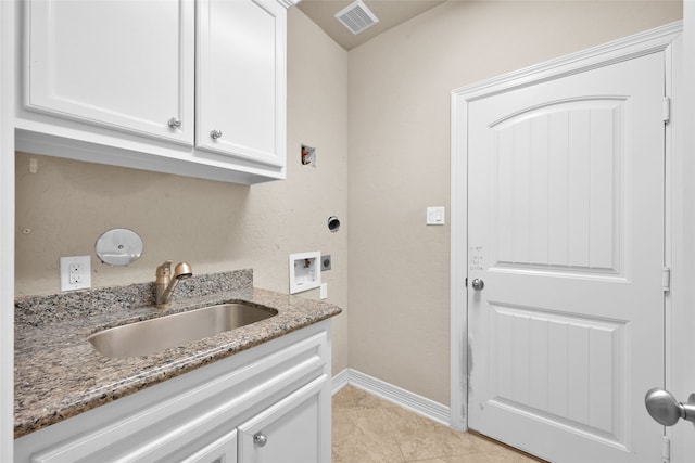 laundry area featuring cabinets, washer hookup, light tile patterned floors, electric dryer hookup, and sink