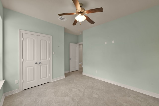 unfurnished bedroom with a closet and ceiling fan