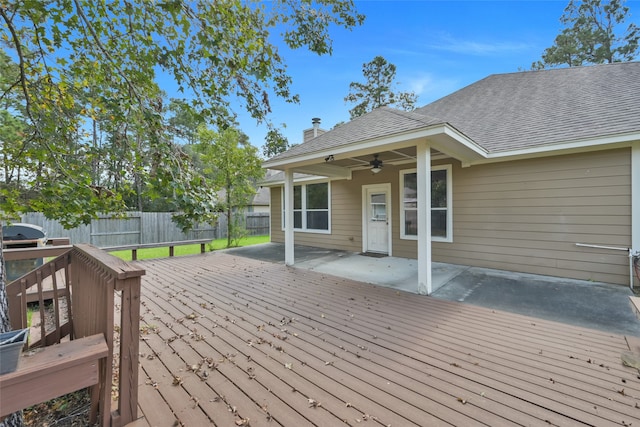 wooden deck featuring ceiling fan