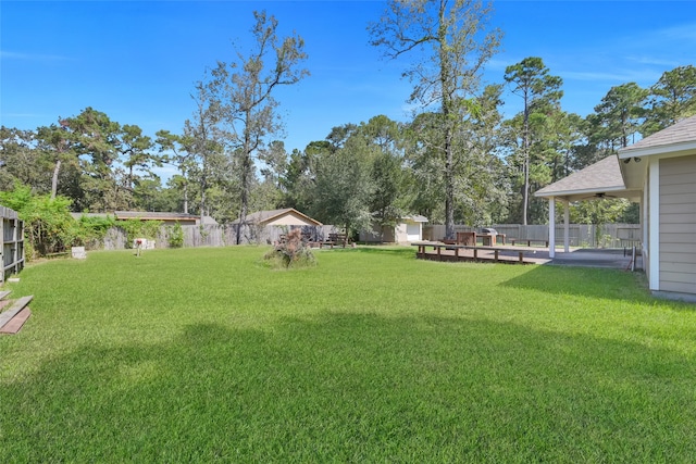 view of yard with a patio area and a deck