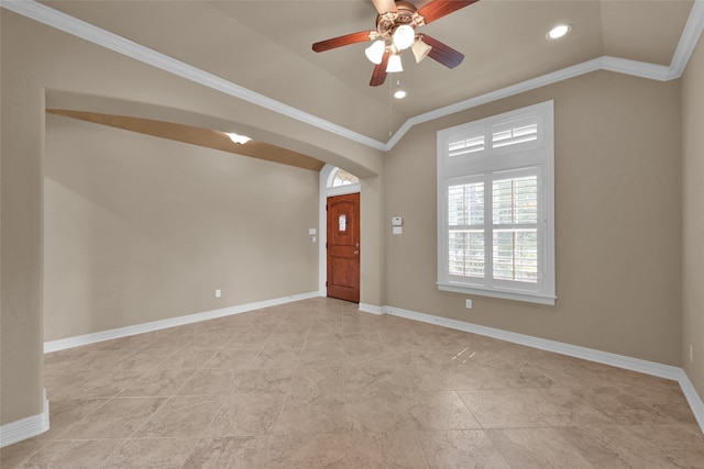 entrance foyer with lofted ceiling, ornamental molding, and ceiling fan