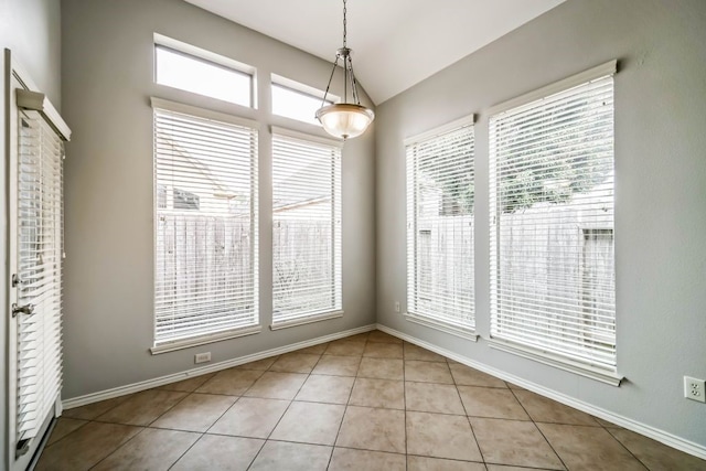 tiled empty room with plenty of natural light