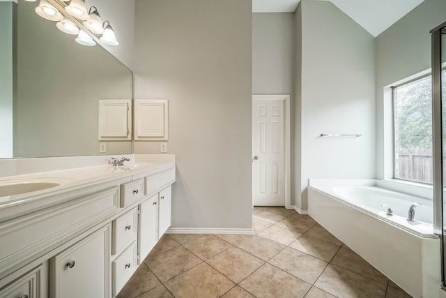 bathroom with double sink vanity, tile floors, a bath, and high vaulted ceiling