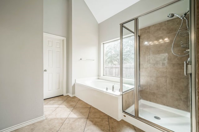 bathroom featuring lofted ceiling, tile flooring, and shower with separate bathtub