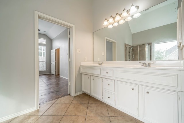 bathroom featuring an enclosed shower, tile floors, dual sinks, large vanity, and lofted ceiling