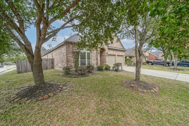 view of front of property with a front lawn and a garage