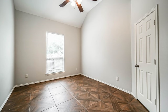 unfurnished room with ceiling fan and lofted ceiling