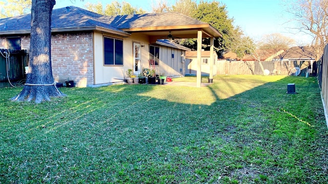 view of yard featuring ceiling fan