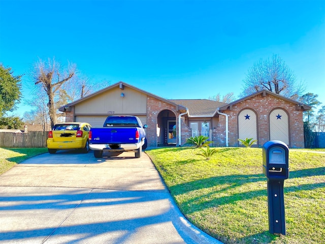 ranch-style home with a front yard and a garage