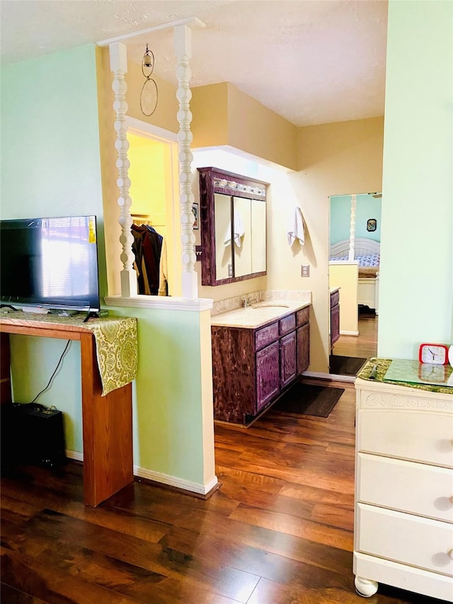 bathroom with hardwood / wood-style flooring and vanity