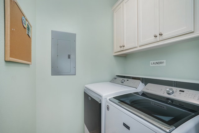 washroom featuring separate washer and dryer and cabinets