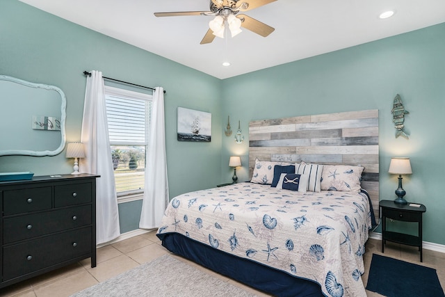 tiled bedroom featuring ceiling fan