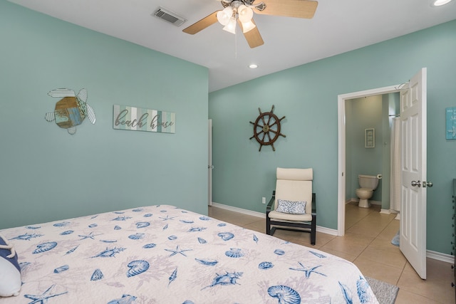 bedroom with light tile flooring, ensuite bathroom, and ceiling fan