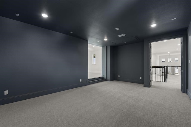 empty room with light colored carpet