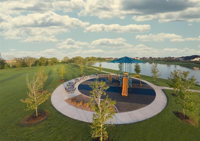 view of home's community featuring a yard, a water view, and a playground