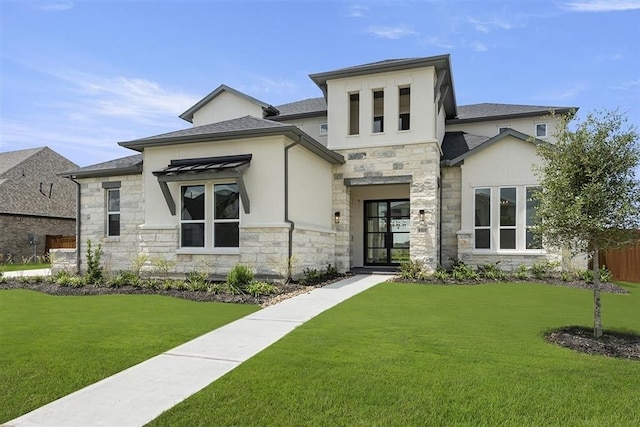 view of front of home featuring stone siding, a front yard, and stucco siding