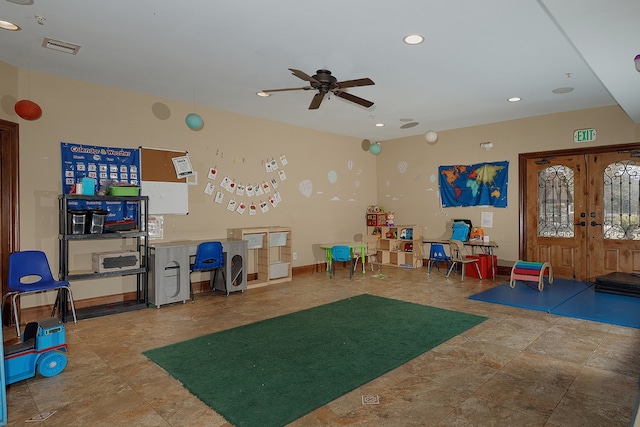 rec room with french doors and ceiling fan