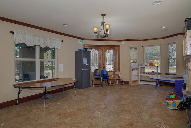 interior space with ornamental molding and a notable chandelier