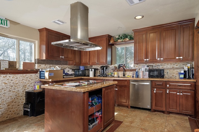 kitchen featuring island exhaust hood, a healthy amount of sunlight, a center island, and dishwasher