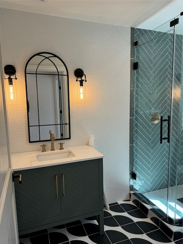 bathroom with vanity and an enclosed shower