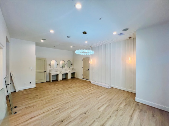 unfurnished living room with light wood-type flooring