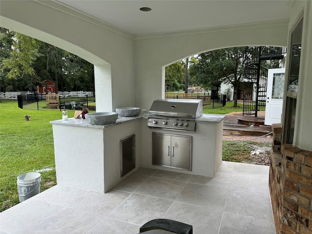 view of patio with area for grilling and an outdoor kitchen