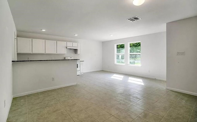 unfurnished living room with light tile floors