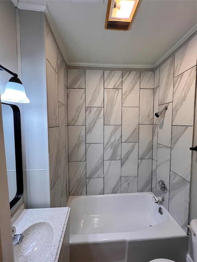 full bathroom featuring toilet, vanity, and tiled shower / bath