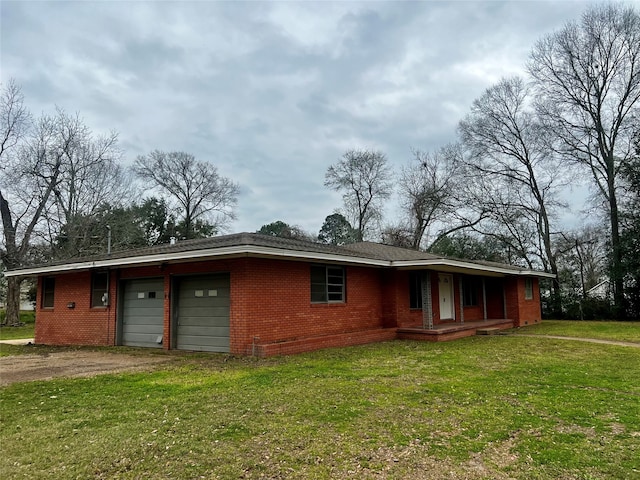 single story home with a front lawn and a garage