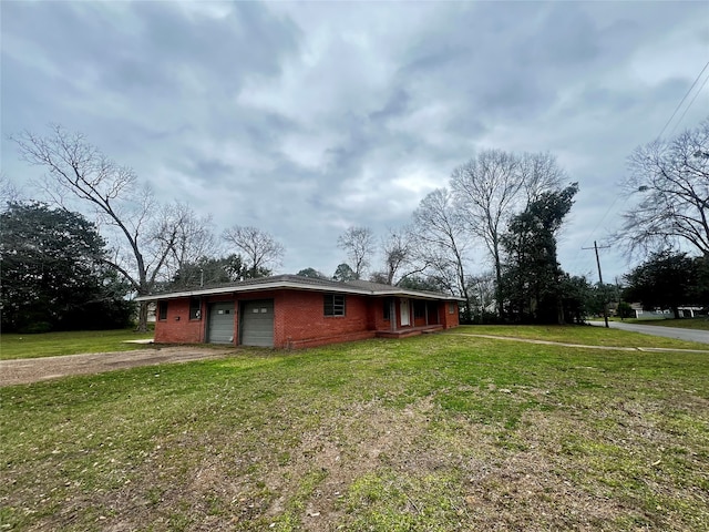 exterior space with a front lawn and a garage