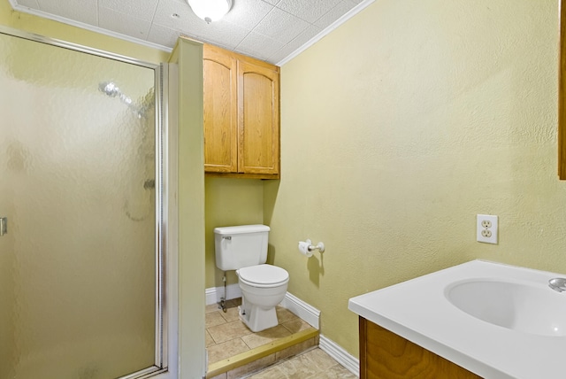 bathroom featuring toilet, tile floors, vanity, and a shower with door