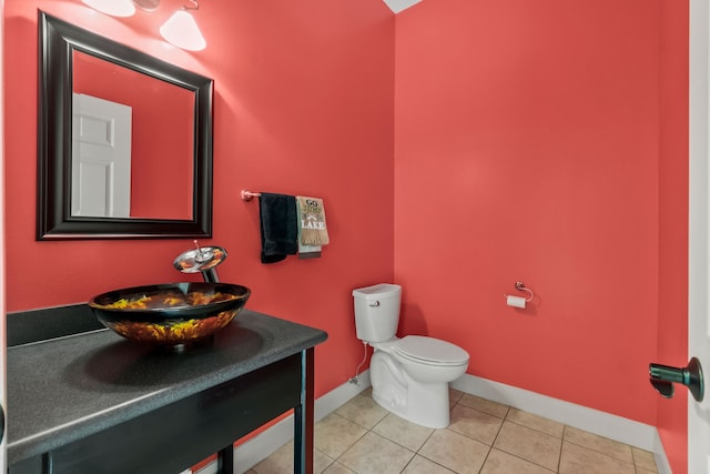 bathroom featuring vanity, tile floors, and toilet