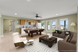 living room with billiards, ceiling fan, and light tile floors