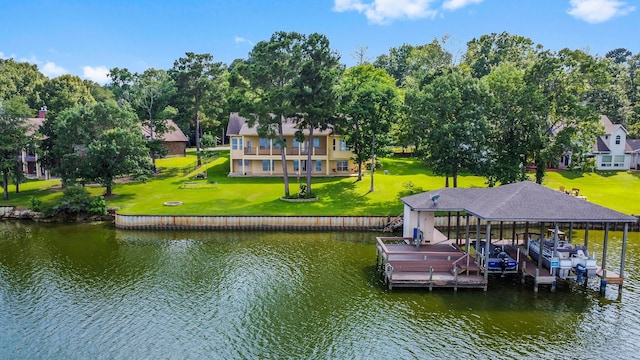 view of dock featuring a lawn and a water view