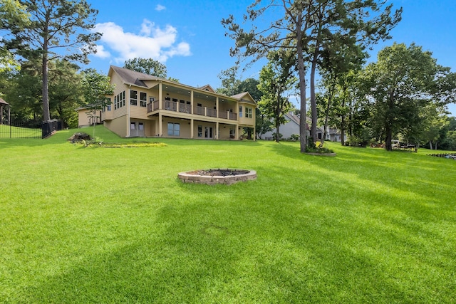 view of yard with an outdoor fire pit