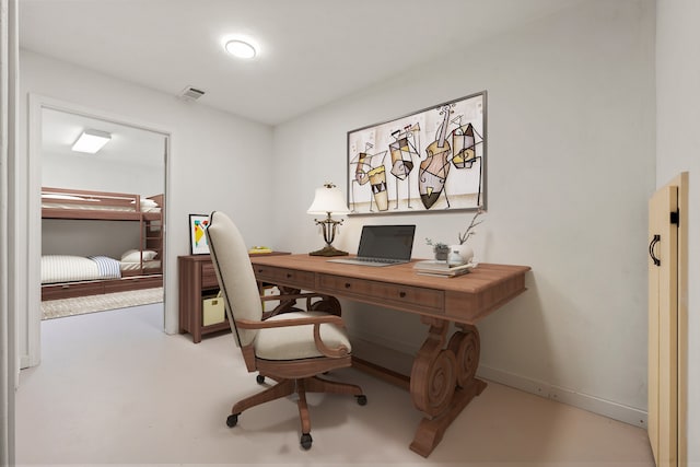 office space with concrete flooring