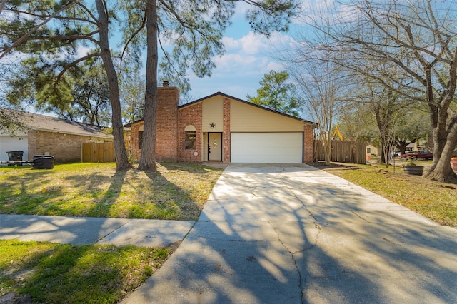 ranch-style home with a garage and a front yard